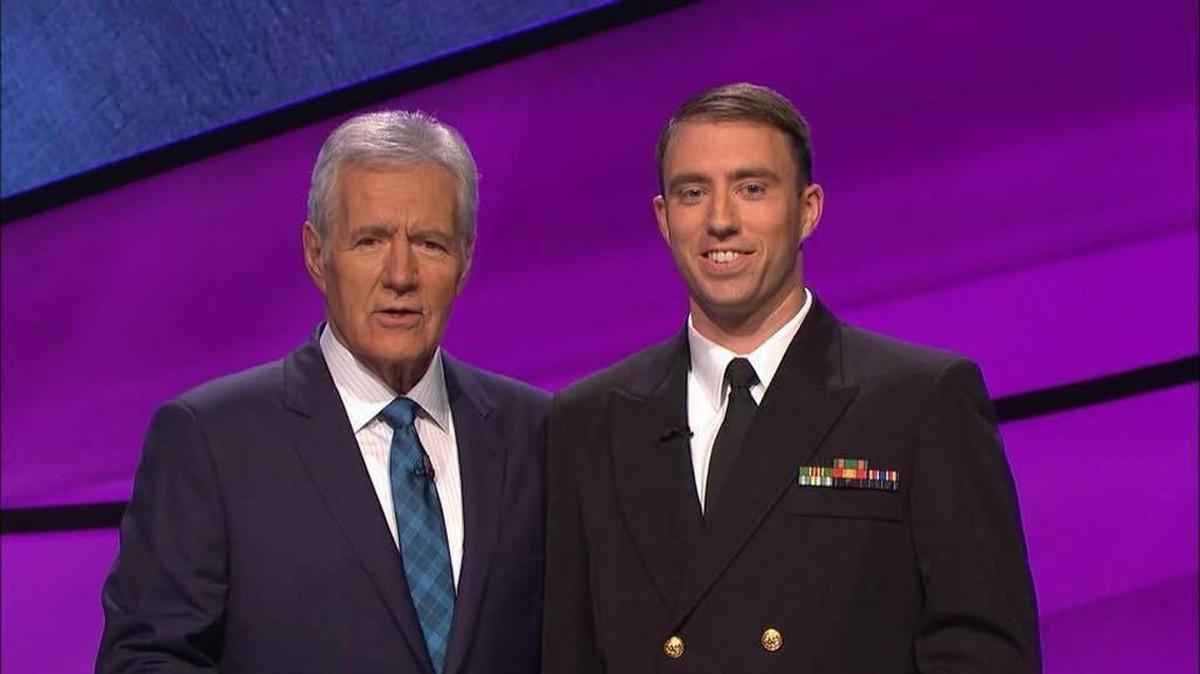 Wichita native Tanner Hesse, 30, right, with “Jeopardy!” host Alex Trebek.