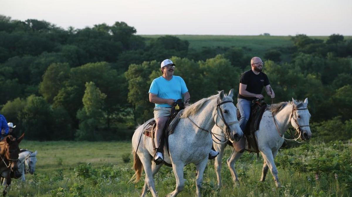 People take a moonlight horse ride at Cedar Point’s Flying W Ranch.
