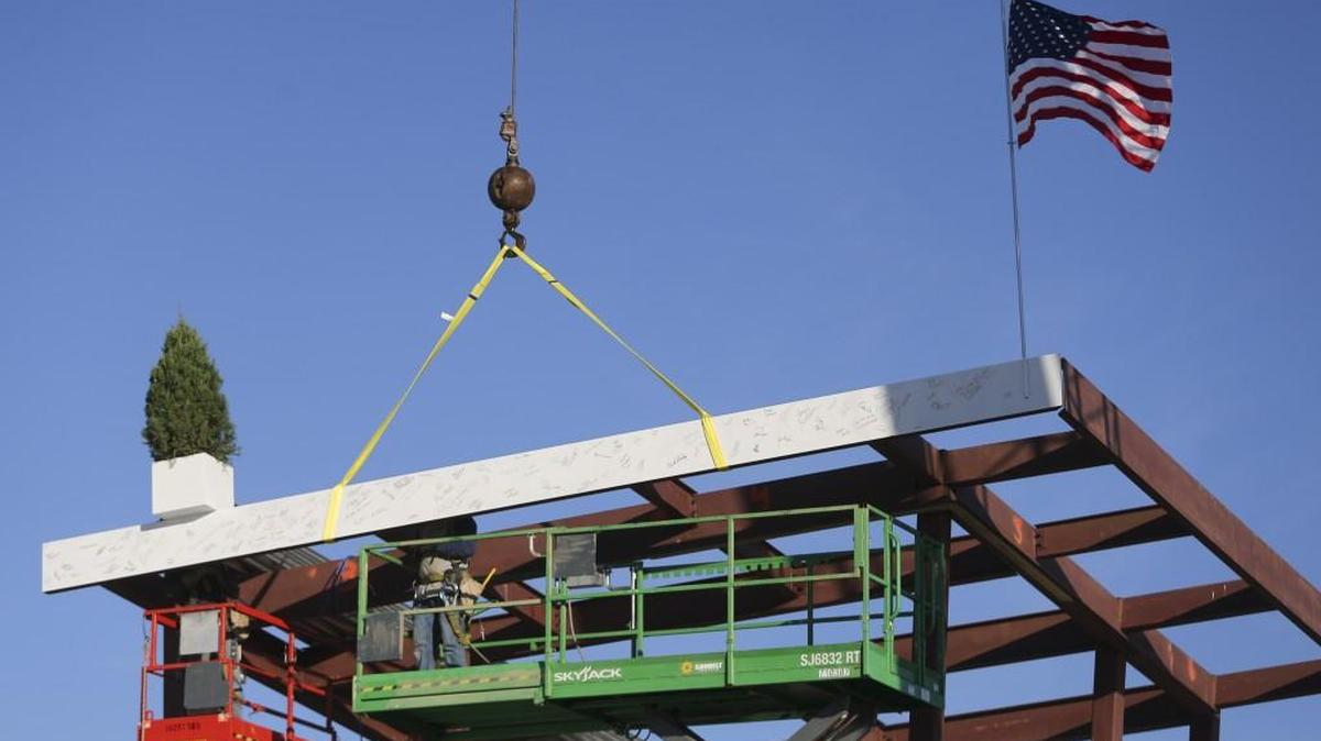 The final top beam is installed on the new Mark Arts building on Dec. 13 during a topping ceremony. Liz Koch announced during the ceremony that the new arts center would open on Dec. 31, 2017.
