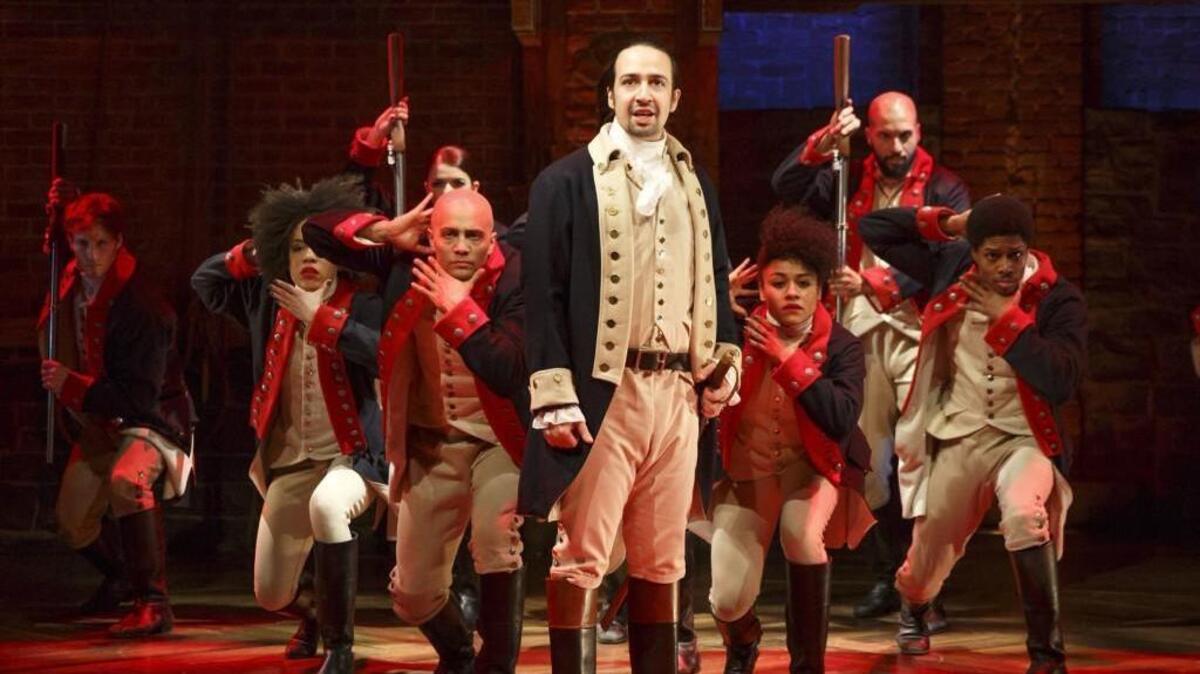 Lin-Manuel Miranda, foreground, performs in the musical “Hamilton” in New York. “Hamilton” is coming to Kansas City, Mo.