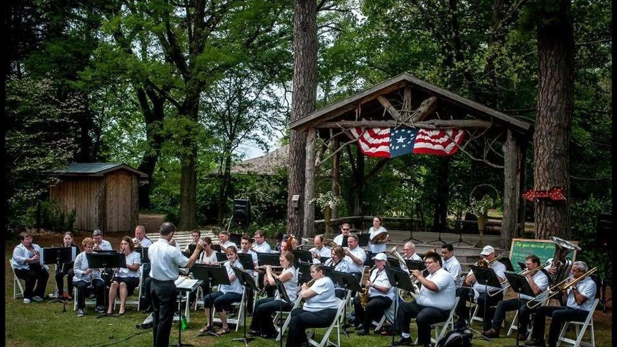 A big band-style performance takes place under the canopy of trees at Art at the Arb in 2015.