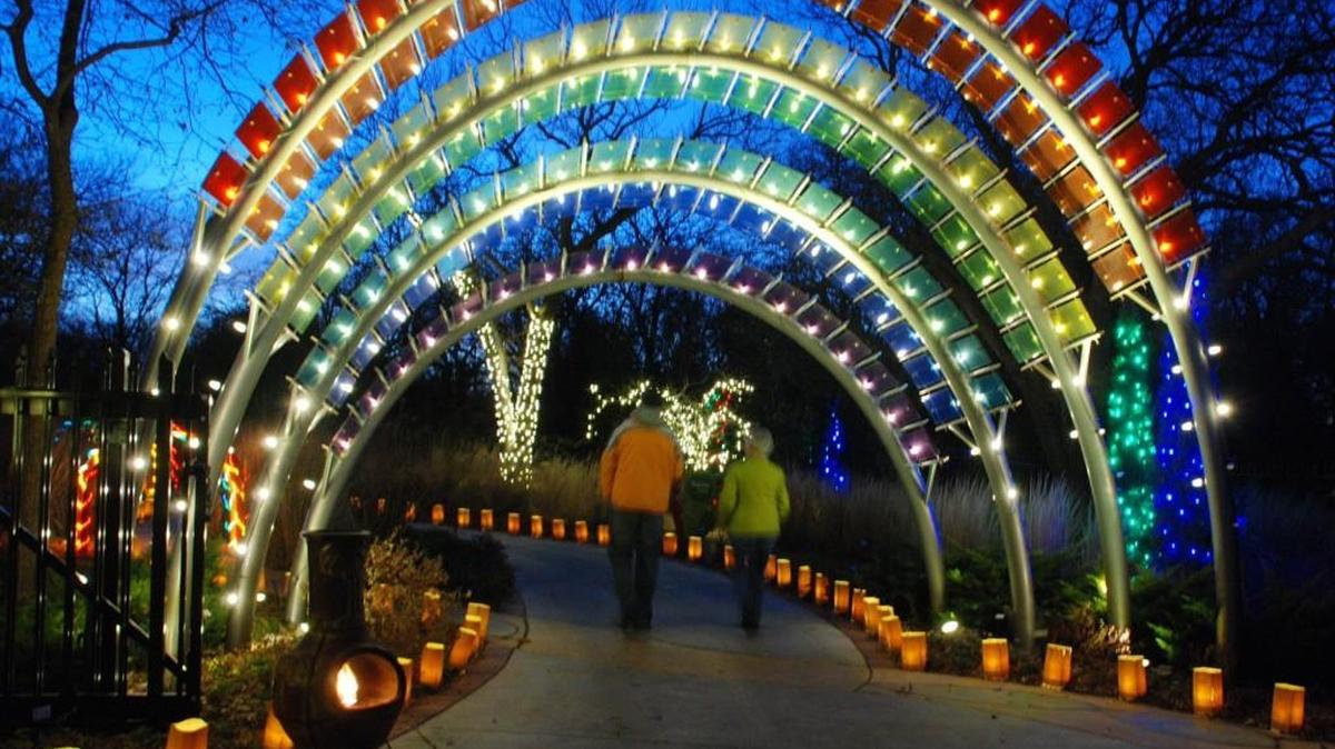 Lighted arches point the way to the Downing Children’s Garden at Illuminations at Botanica.