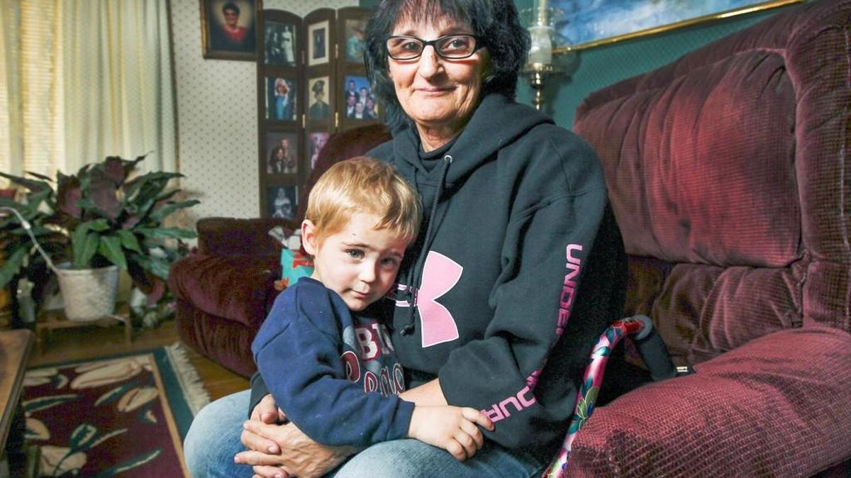 Julia Harris helps take care of her 2-year-old grandson C.J. Harris has been staying at her mother’s home in west Wichita. She has a blood clot in her leg and will have hip surgery on Monday. (Nov. 25, 2015)
