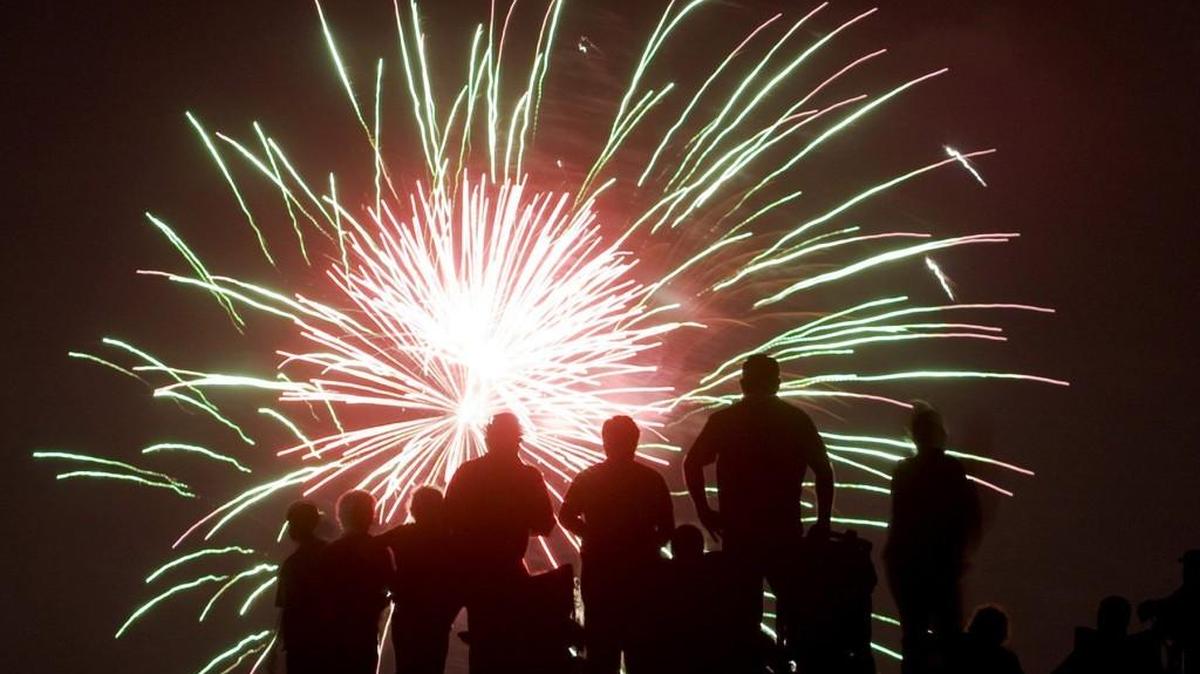 A crowd watches the Fourth of July fireworks near Exploration Place in this file photo.