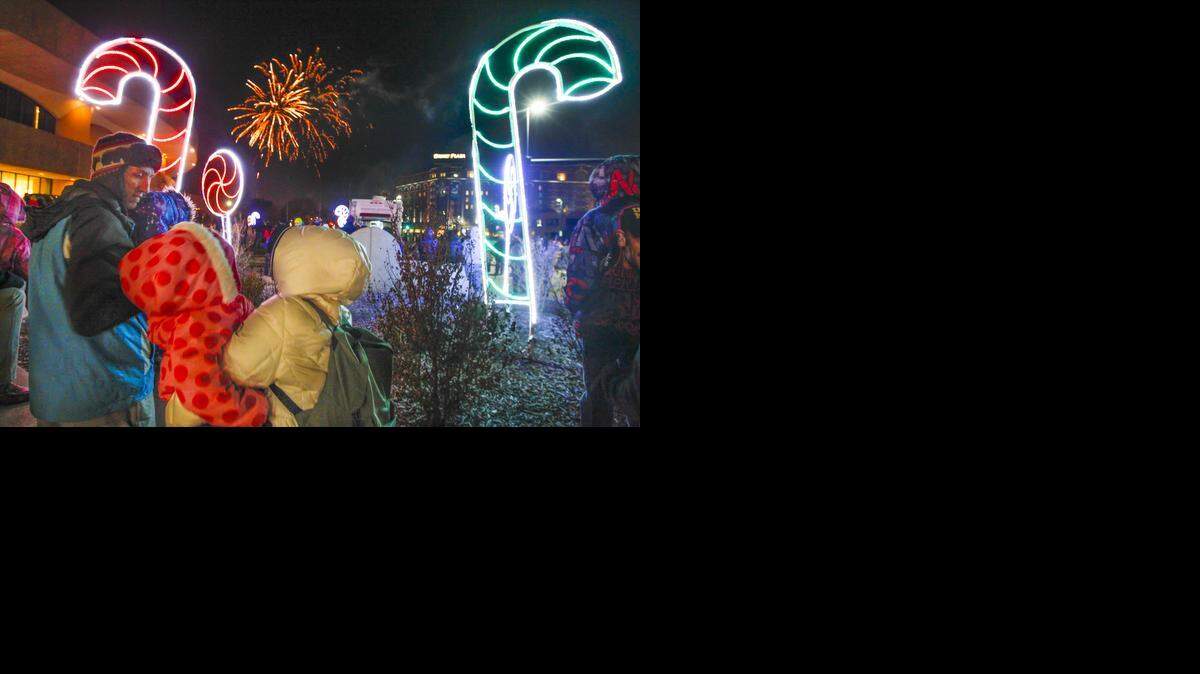 
People watch the fireworks show Tuesday night outside Century II during “A Night with Santa,” the city’s Christmas celebration. (Dec. 2, 2014)
