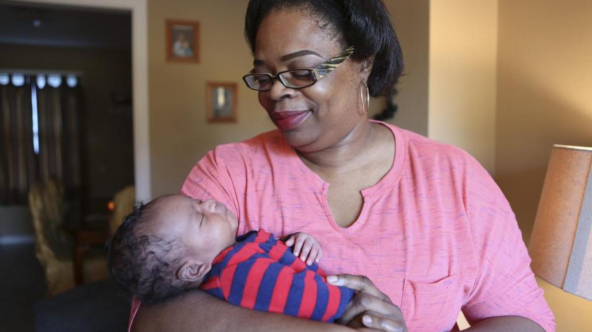 LaSherrie Herndon holds her week-old grandson, Jaxson Everett. Herndon was one person who received help in 2016 from Share the Season.