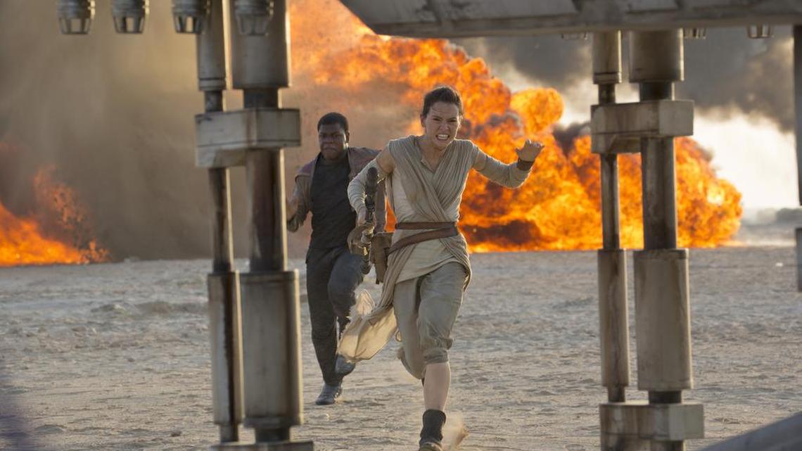 Daisy Ridley, right, as Rey, and John Boyega as Finn, in a scene from the film, “Star Wars: The Force Awakens,” directed by J.J. Abrams. Early screenings of the film begin Thursday night, Dec. 17, 2015.