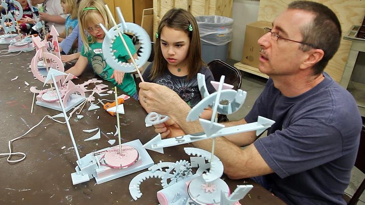 Instructor and sculptor Tom McGuire assists Gabriella Santos, 7, with her kinetic foam sculpture in a spring break art class at CityArts in 2010. For spring break 2016, CityArts is offering Passport to Art, weeklong exploration of art forms of different countries, for ages 6 to 15.