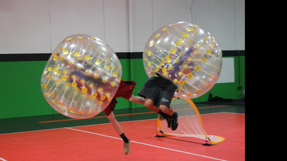 
A body zorbing ball allows players to bounce off each other in bubble soccer games at the Wichita Sports Center. 
