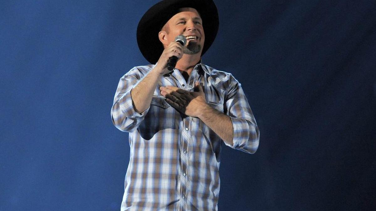 
FILE - This April 7, 2013 file photo shows Garth Brooks performing at the 48th Annual Academy of Country Music Awards in Las Vegas, Nev. Brooks will perform a rare live broadcast concert special from the Encore Theater at the Wynn Las Vegas on Friday, Nov. 29. (Photo by Chris Pizzello/Invision/AP, File) 
