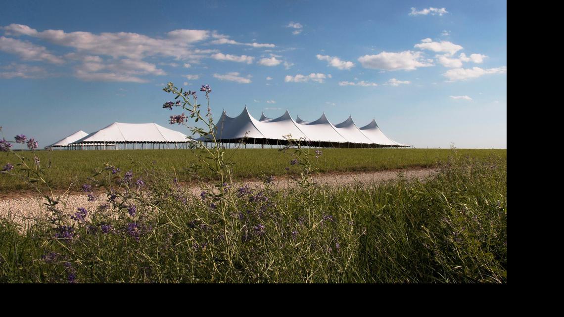 
Crews are preparing tents and walking paths for the 10th Symphony in the Flint Hills concert at the Tallgrass Prarie National Preserve north of Strong City. 
