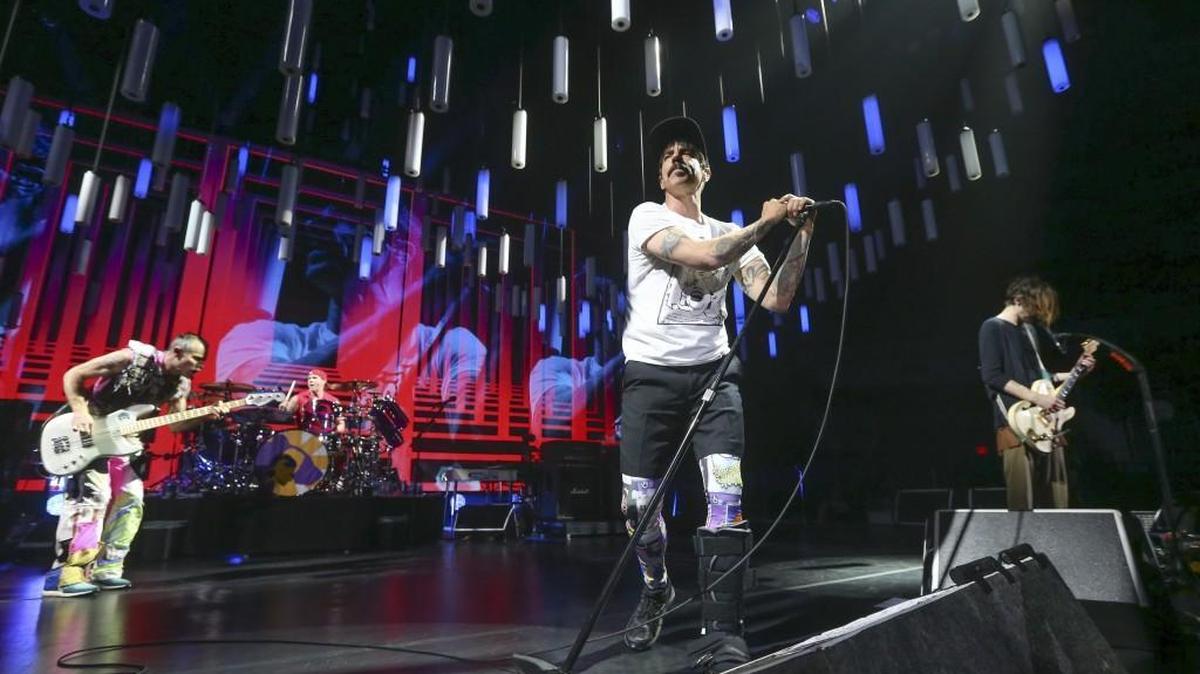 Members of the Red Hot Chili Peppers, from left, Flea, Chad Smith, Anthony Kiedis and Josh Klinghoffer perform for a full house at Intrust Bank Arena on Monday night. (Jan. 16, 2017)