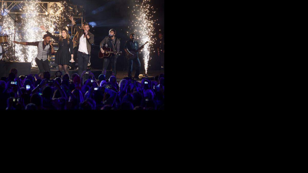 
From left, Aloe Blacc performs with Hilary Scott, Charles Kelley and Dave Haywood of Lady Antebellum at the CMT Ultimate KickOff Party at Kay Bailey Hutchison Convention Center on Friday, Jan. 9, 2015, in Dallas. 

