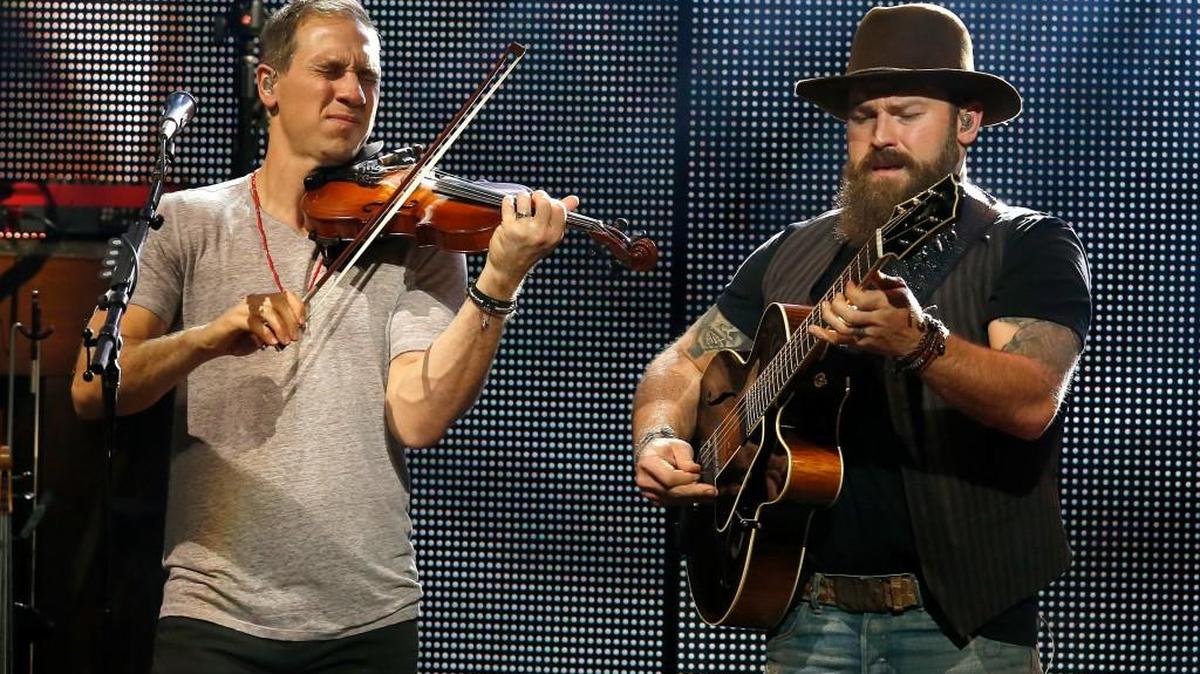 Jimmy De Martini, left, and Zac Brown of the Zac Brown Band performs at Ak-Chin Pavilion on Thursday, Oct. 8, 2015, in Phoenix, Arizona.