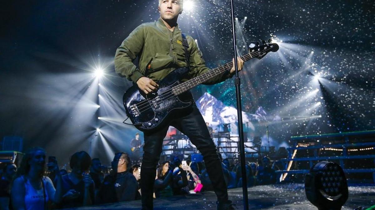 Fall Out Boy bassist Pete Wentz entertains the crowd at Intrust Bank Arena on Tuesday night. (March 22, 2016)