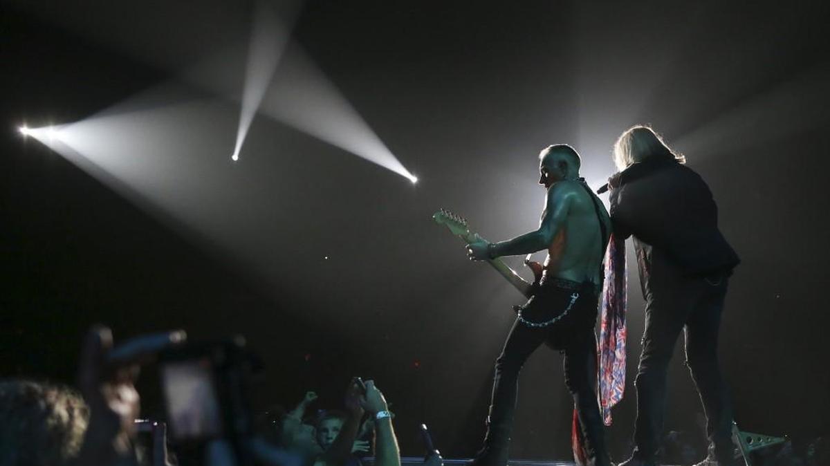 
Def Leppard singer Joe Elliott and guitarist Phil Collen play during the band’s opening song Saturday night at Intrust Bank Arena. (Oct. 10, 2015)
