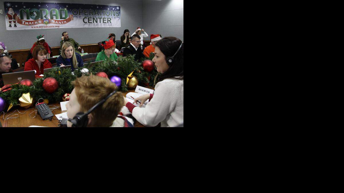 
Volunteers take phone calls from children on Christmas Eve in 2012 asking where Santa is and when he will deliver presents to their homes, during the annual NORAD Tracks Santa Operation, at the North American Aerospace Defense Command, or NORAD, at Peterson Air Force Base, Colo. This year, Santa is poised for another monster year on social media. NORAD Tracks Santa has already attracted a record 1.49 million Facebook “likes” before the journey even begins. And for Christmas Eve 2014, there’s a website version for smartphones.
