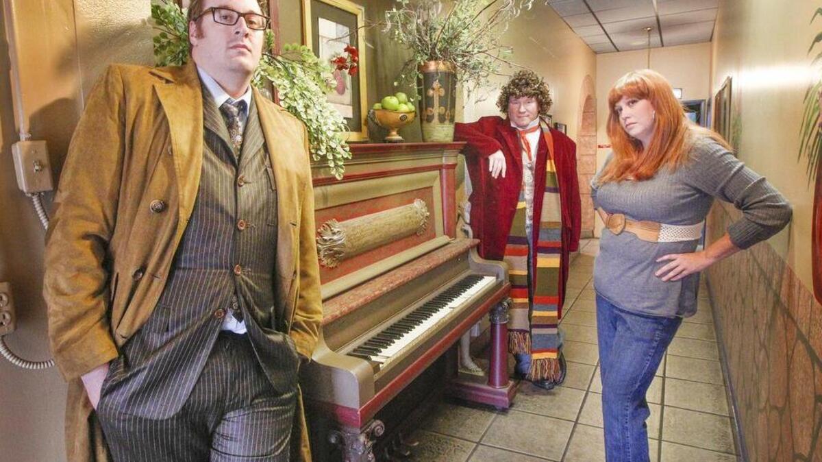 
Derek Ledford, Sean Beorn and Lisa Turner, photographed Thursday at La Galette Cafe and Bakery, get ready for the Doctor Who convention in Wichita this weekend. 
