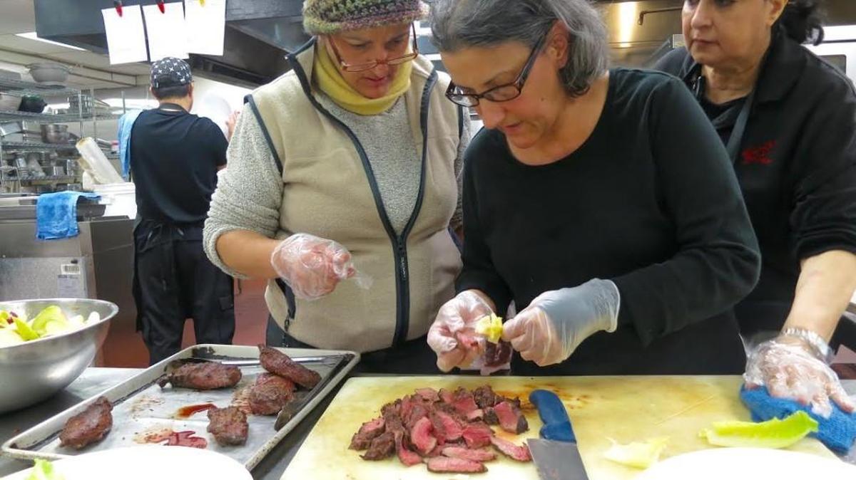 Longtime Wichita chefs Joumana and Randa Toubia work in the Latour kitchen to prepare a catering order.