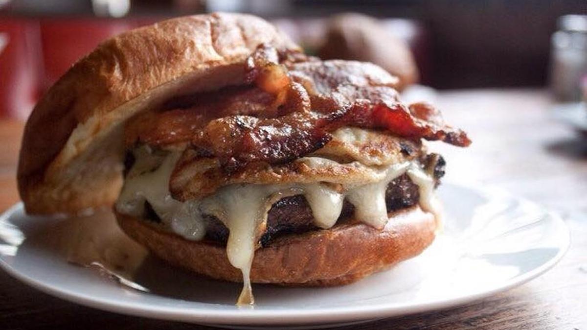 Ashley Watkins says that after eating Dempsey’s egg burger, she can’t imagine why anyone would eat a burger without an egg on top.