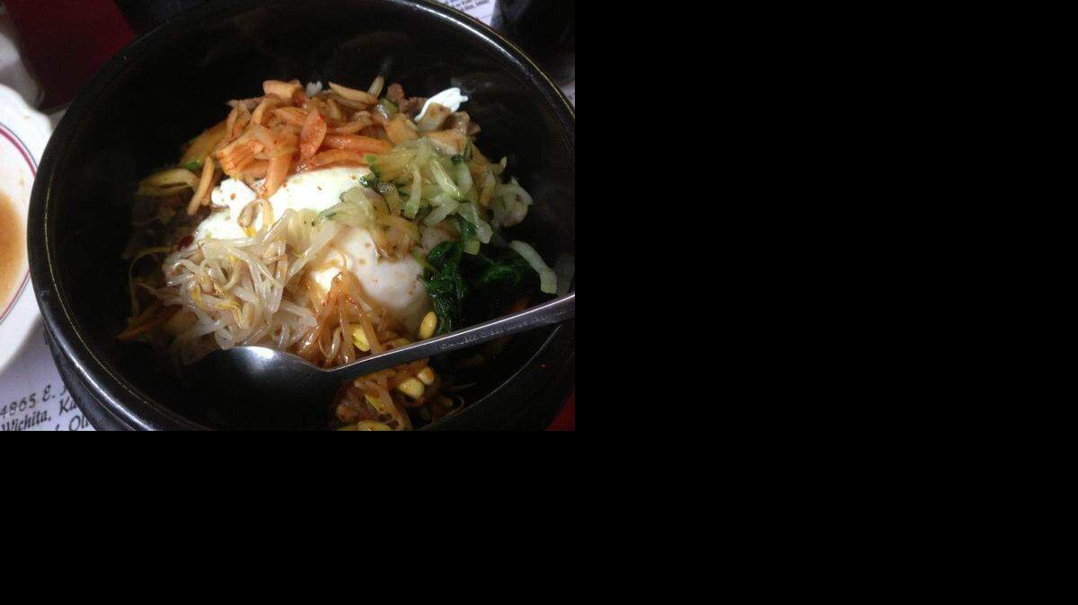 
The bi bim bap in a stone bowl is one of Manna Wok’s best dishes.
