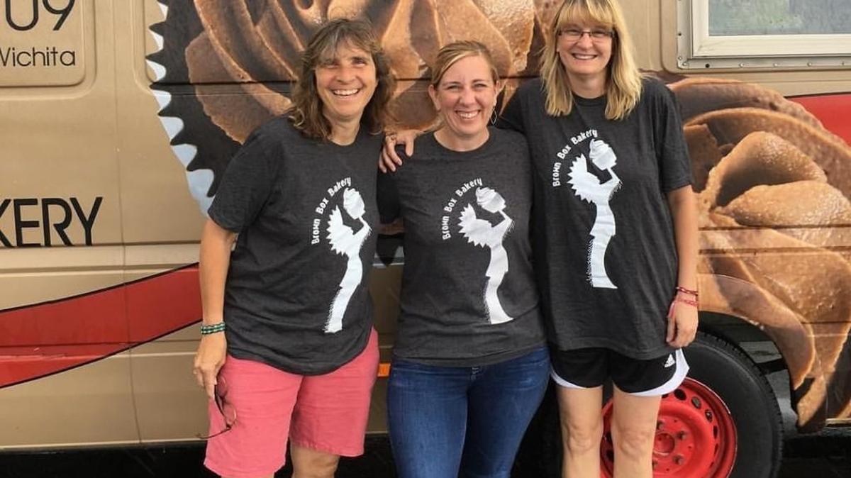 Tami McCue, left, and Ginger Wilson, right, are the new owners of The Brown Box Bakery cupcake truck. They purchased it from Anna Hastings, center.