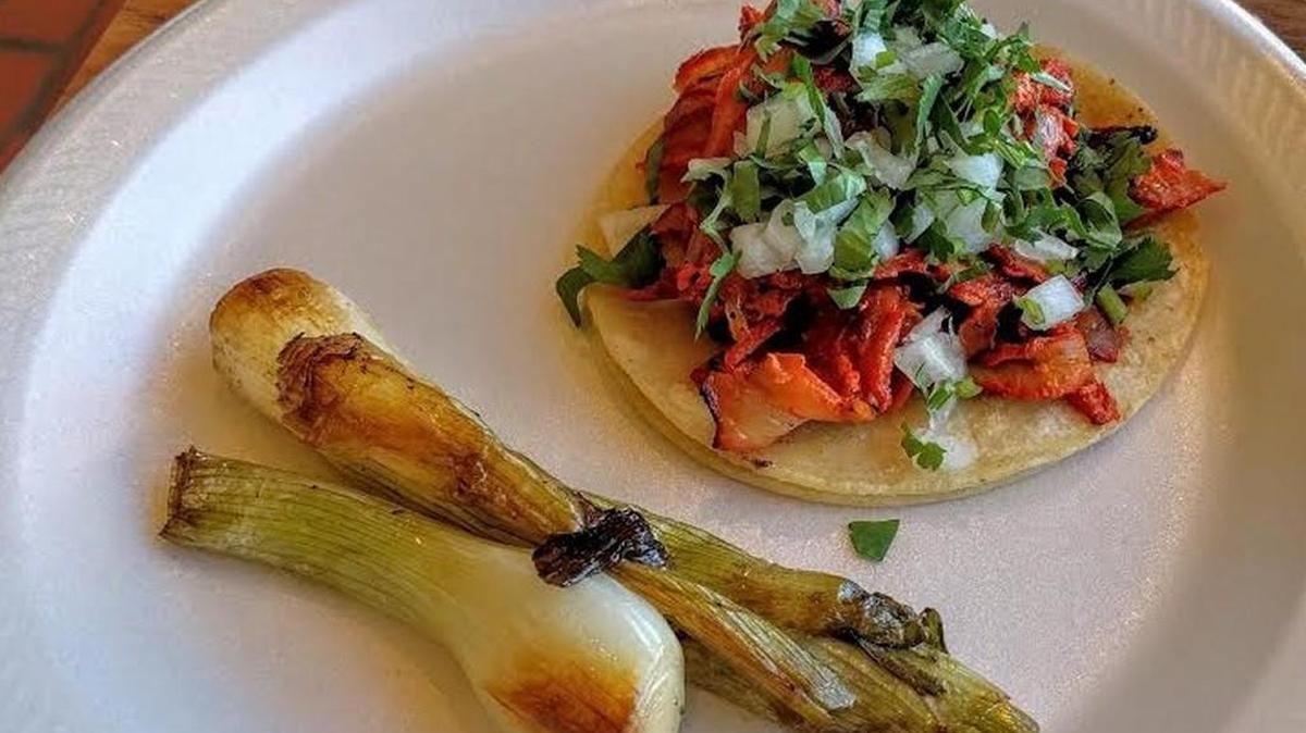 Al pastor from a rotisserie is served in the tacos at Taqueria El Fogon.