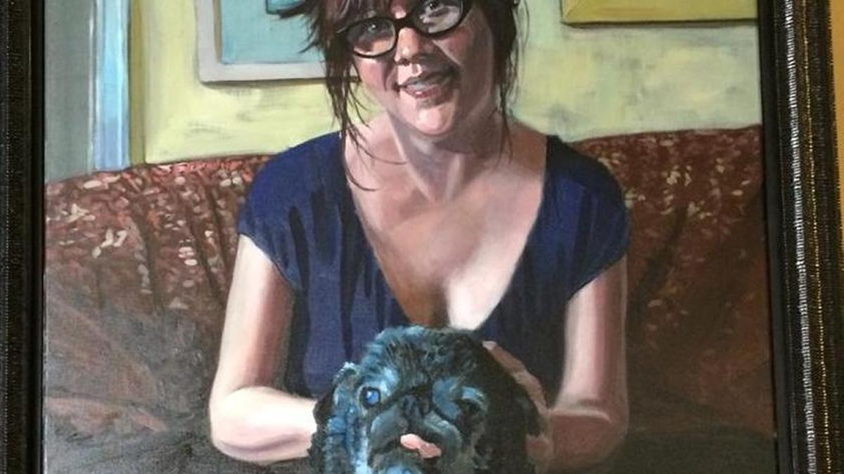 A portrait of the late Tanya Tandoc and her pug, Olive, hangs in the restaurant she founded, Tanya’s Soup Kitchen. Olive died today at age 18. Local artist Richard Davies painted the portrait.
