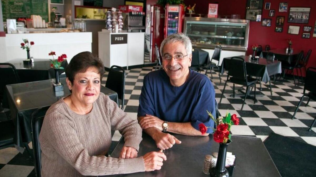 This photo of Toni and Dan Shadid was taken just after they announced they were closing their Carriage Parkway business.