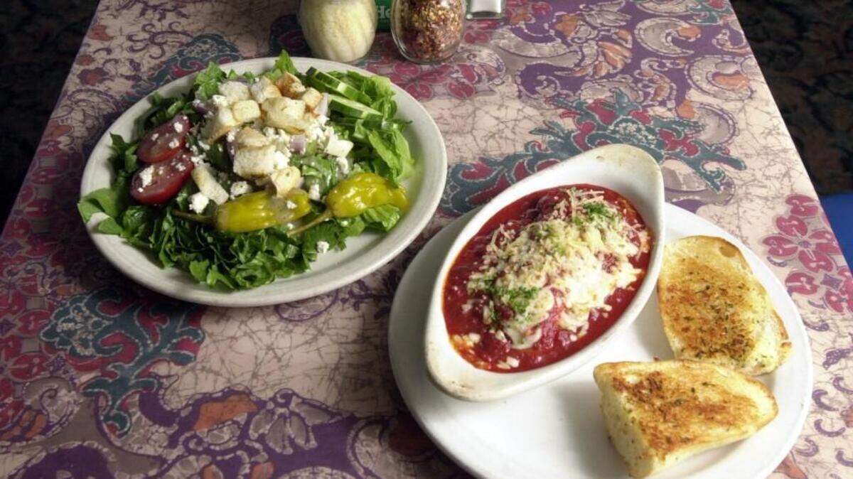 Marchello’s meat lasagna with large Greek salad