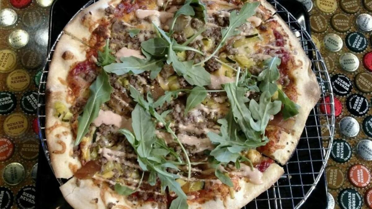 Dempsey’s Burger Pub’s entry in the Wichita Brewing Company pizza-a-month contest features all the toppings you’d want on a cheeseburger.