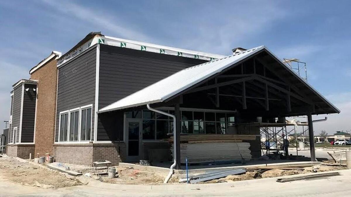 This building going up near 21st and Greenwich will soon be home to a Slim Chickens fried chicken restaurant.