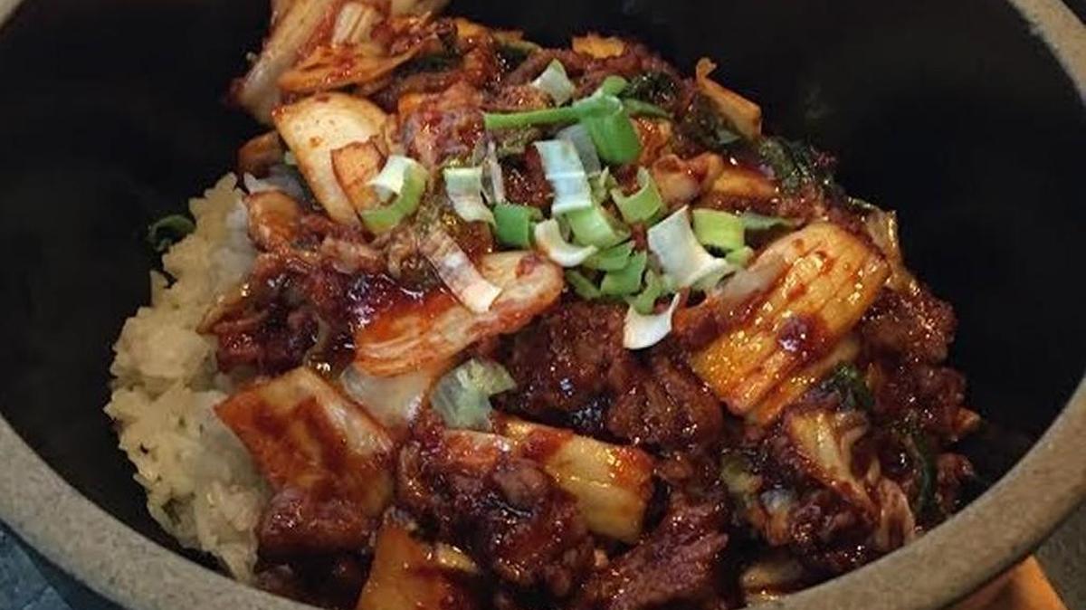 The kimchi dolsot at Hot Stone Korean Grill on North Rock Road is served in a searing hot stone bowl.