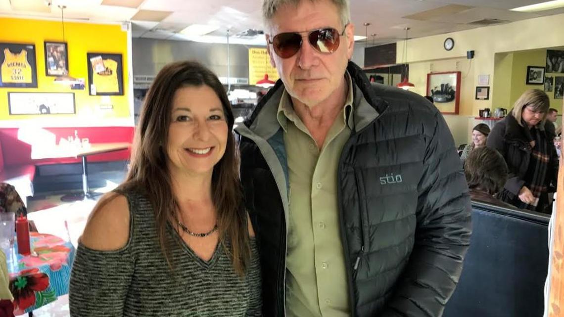 Timirie Shibley poses with celebrity Harrison Ford as he leaves her diner after breakfast on Friday morning. (Feb. 3, 2017)