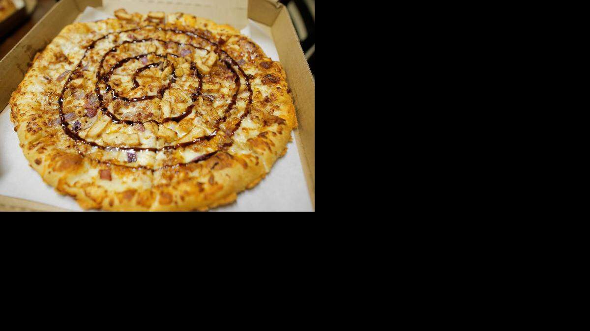 
Pizza Hut’s new Giddy-Up BBQ Chicken Pizza has a barbecue sauce “drizzle” and a crust rimmed with baked cheese.
