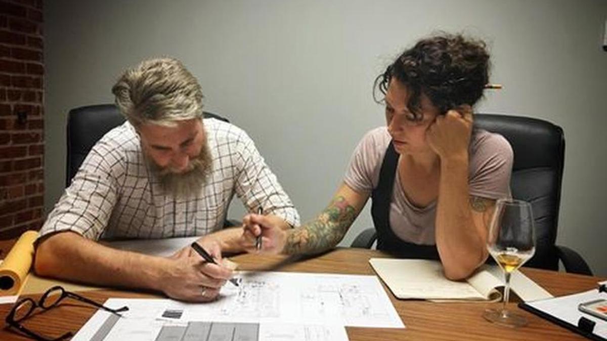 Schane Gross, pictured here with Studium ICT’s Tony Jacobs, is dusting off the blueprints for a long-planned remodel of The Anchor. There’s no definite plan but she hopes to make some changes before the 2018 NCAA Tournament brings its opening rounds to Wichita.