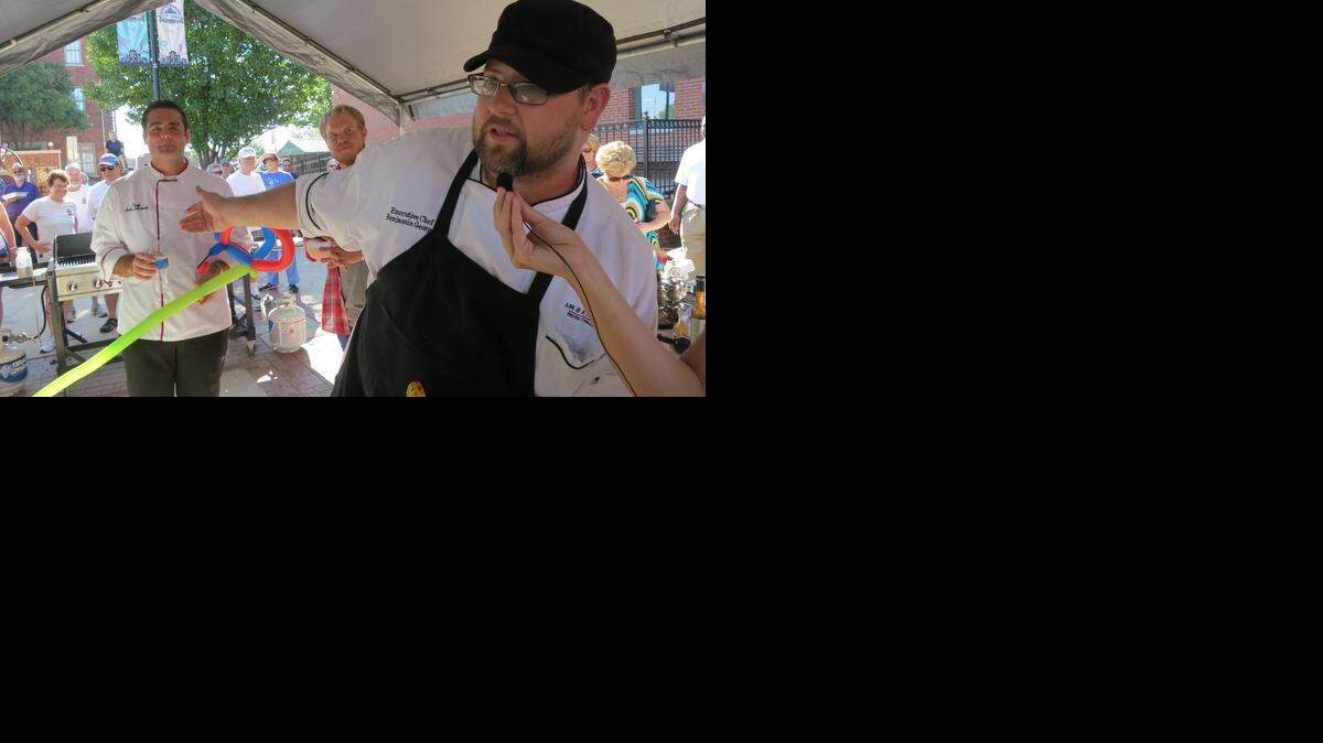 
Chef Ben George addresses the crowd after winning the Old Town Farmers’ Market’s Iron Chef competition.
