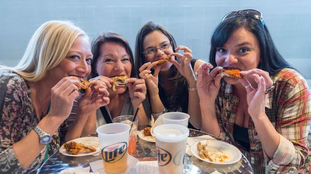 
Chicken wing fans sample the offerings at Tulsa’s Wingapalooza, which served as the inspiration for Saturday’s event at Intrust Bank Arena.
