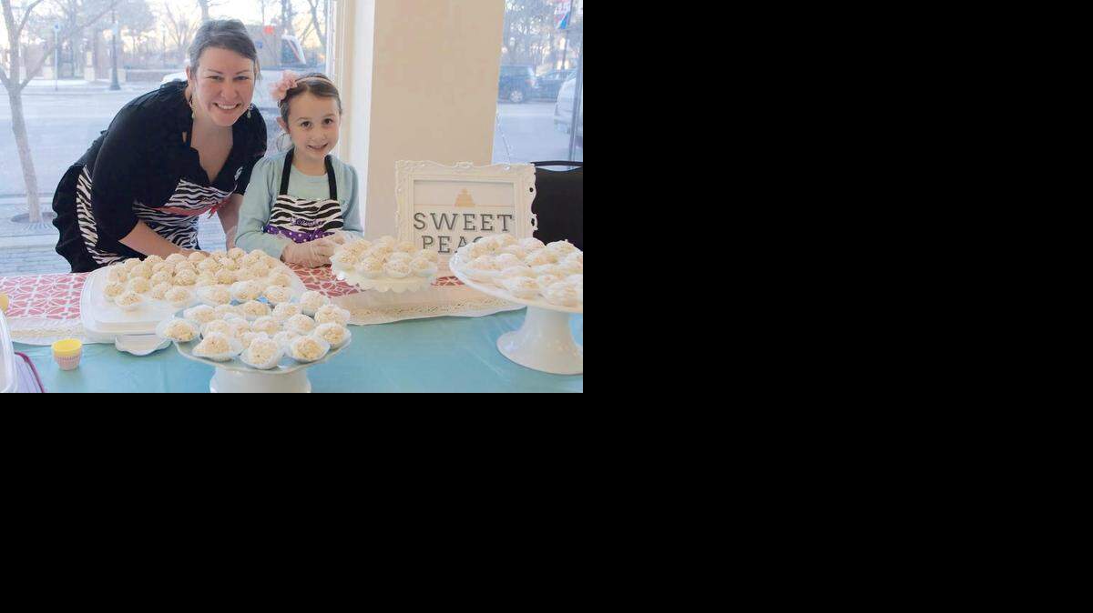 
Jenny Farha, owner of Sweet Peach Cakery and Creations, and her helper at the Throw Down in Old Town.
