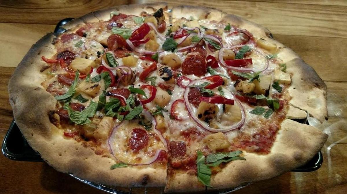 YaYa’s Eurobistro invented a twist on a classic Hawaiian pizza, topped with red sauce, mozzarella, bilbao chorizo, pineapple, Serrano peppers, red onions and mint.