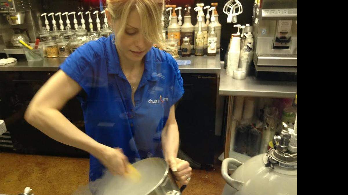 
Jamee Lowe, Churn & Burn’s co-owner, mixes up a concoction using liquid nitrogen.

