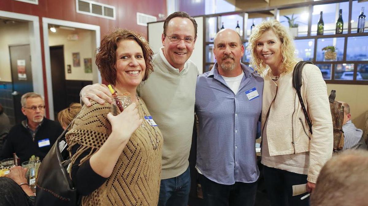 Denise Neil, left, poses with a few VIP guests at the first Dining with Denise Supper Club event: WSU basketball coach Gregg Marshall, Hog Wild Pit Bar-B-Q owner T.D. O’ Connell and Lynn Marshall.
