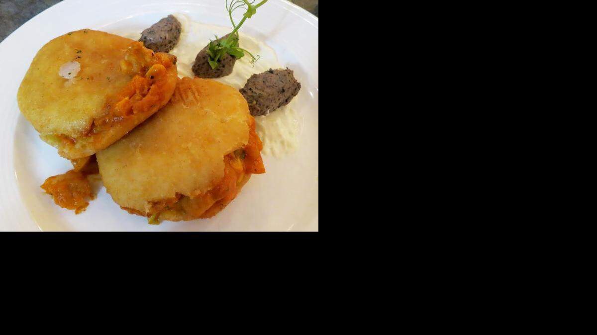 
The Spiny Lobster arepas at Taste and See are corn cakes stuffed with lobster and corn.
