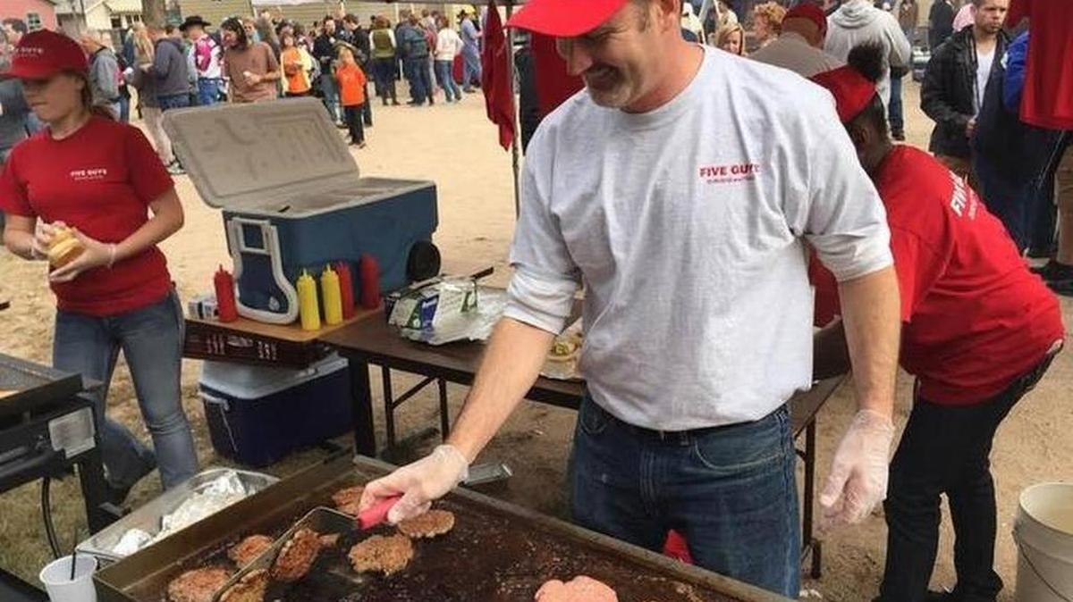 
Jay Miller of Five Guys Burgers and Fries participates in the 2014 Wichita Burger Battle.
