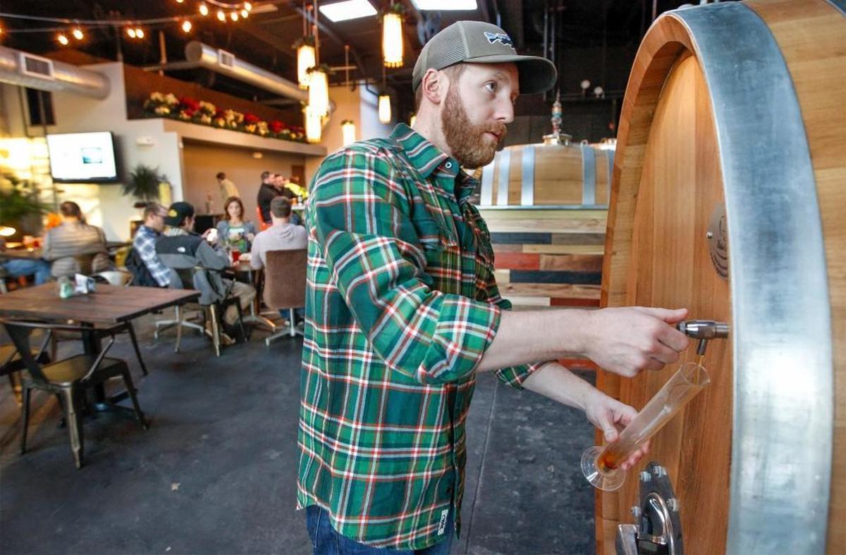 Ian Crane is pictured in the original Central Standard Brewing, which will remain open when the brewery adds another location, this one in Delano.