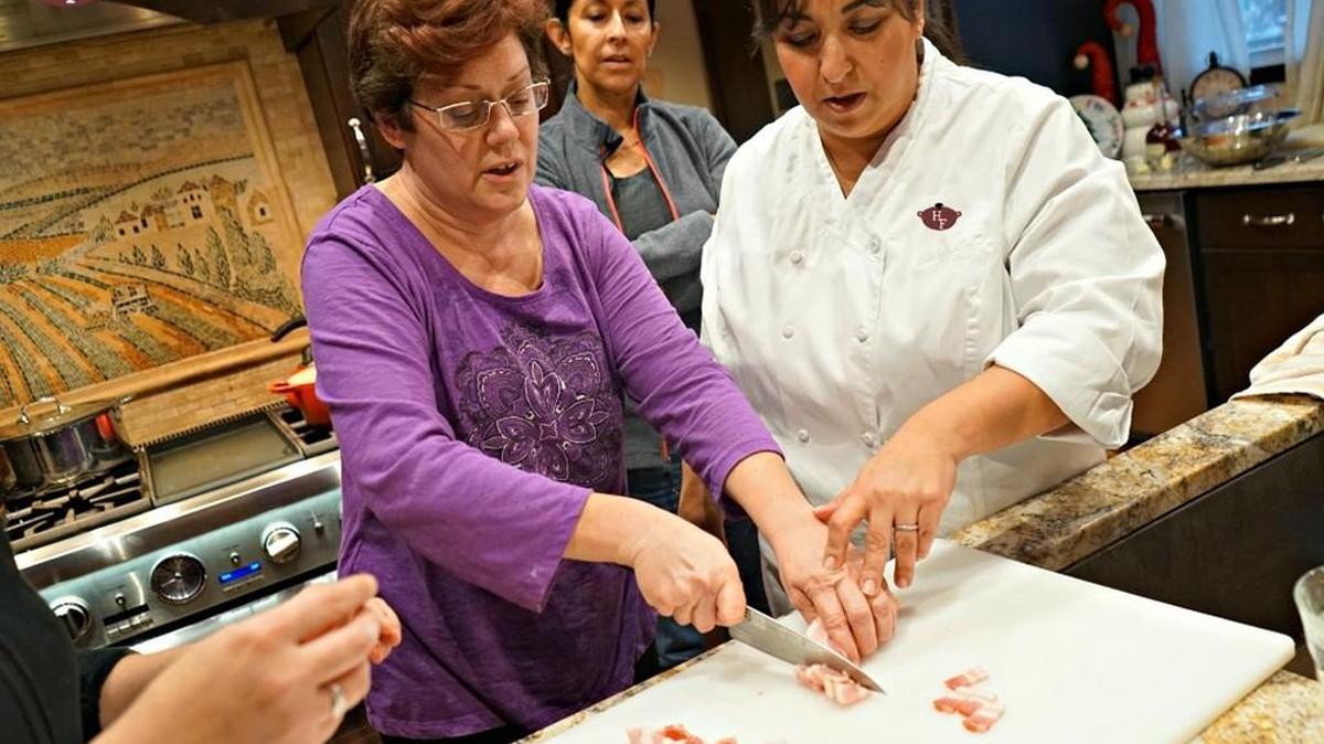 Local chef Natasha Gandhi-Rue, right, is offering cooking classes in her gourmet kitchen and is selling gift certificates for the holidays.