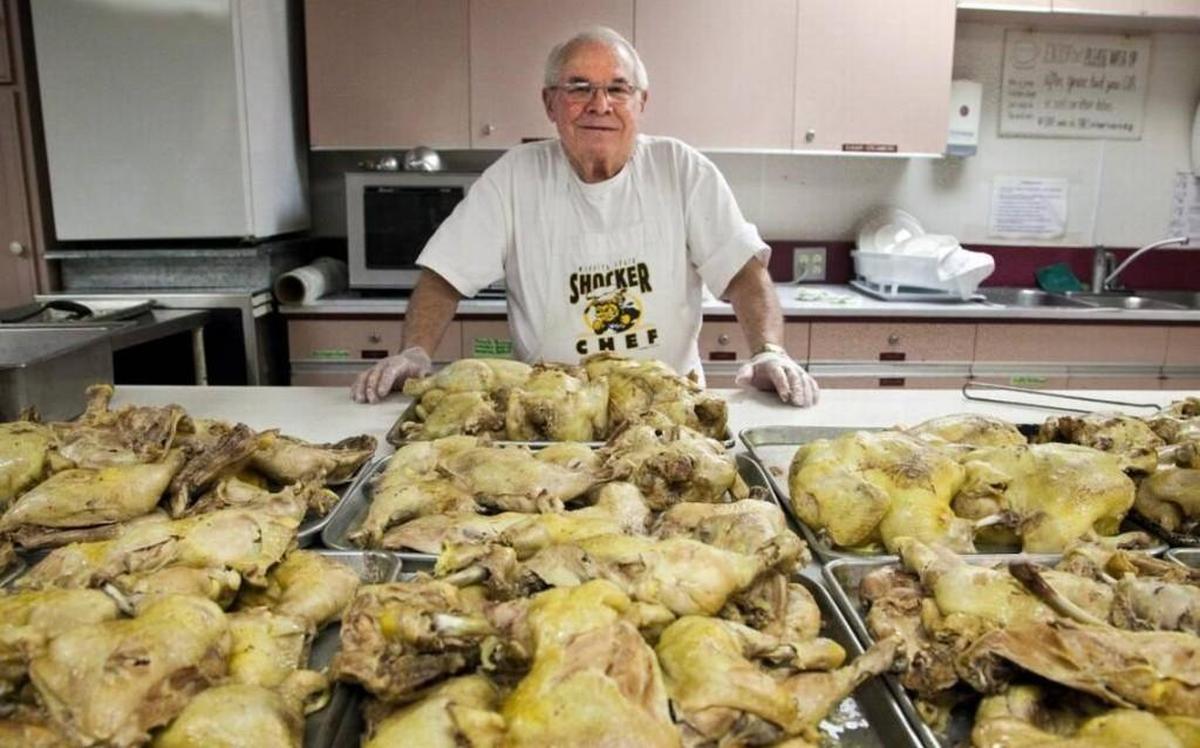 A photo from 2014 shows longtime organizer Cliff Simmons preparing for the annual St. Paul’s dinner.