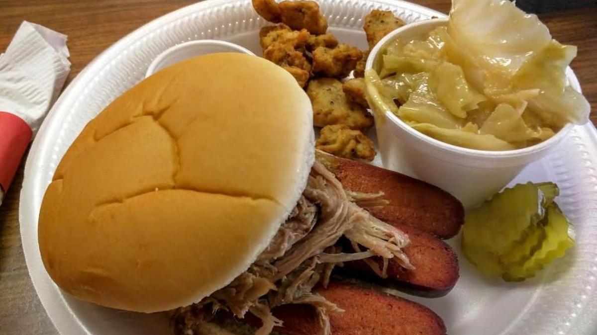 Among the dishes at Augusta’s No Mercy BBQ: a pulled pork and hot link sandwich, fried okra and smoked cabbage.
