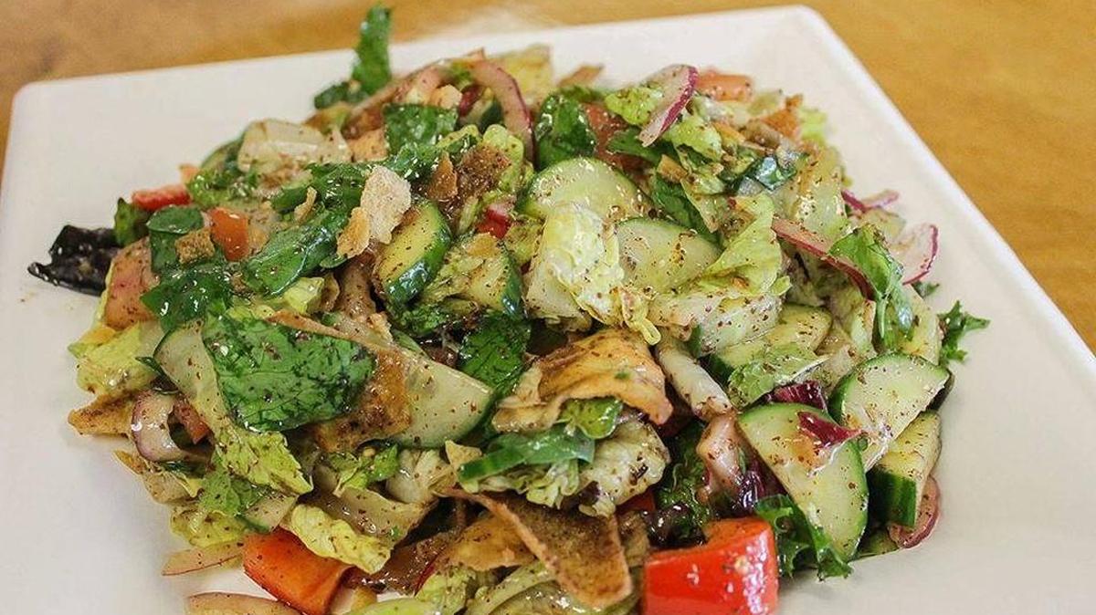 
The fattoush salad at Meddy’s, 7906 E. Harry, is made with romaine lettuce, sliced red onion, English cucumber slices, red peppers, sliced tomatoes, sliced radishes, fresh mint leaves, pita crumbles, sumac, za’atar and fattouch dressing.
