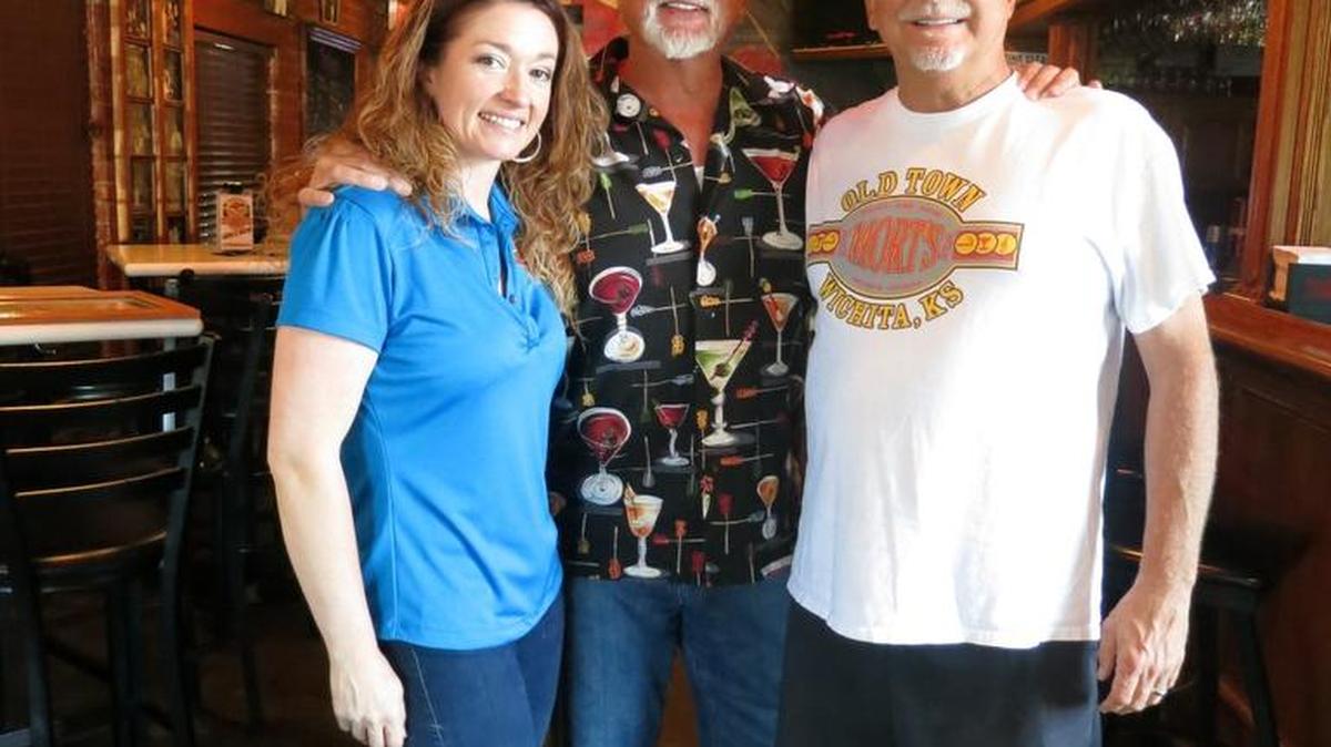 Mort’s Martini & Cigar Bar’s owners, from left, Emma Russell, Morrie Sheets and Matt Sheets, are celebrating 20 years in business this weekend.